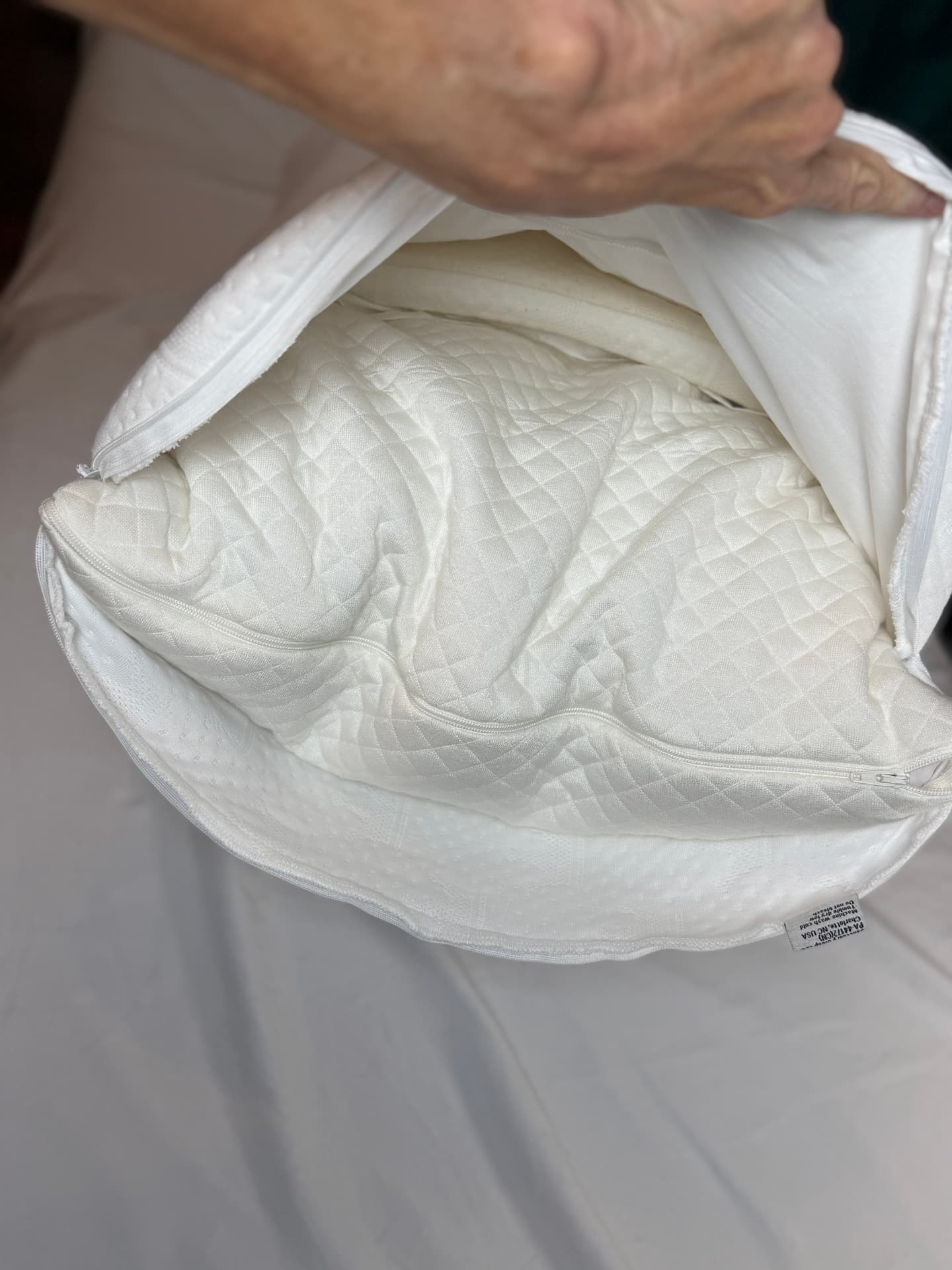 Close-up of the Crown Lift support core resting inside the open pocket pillowcase.