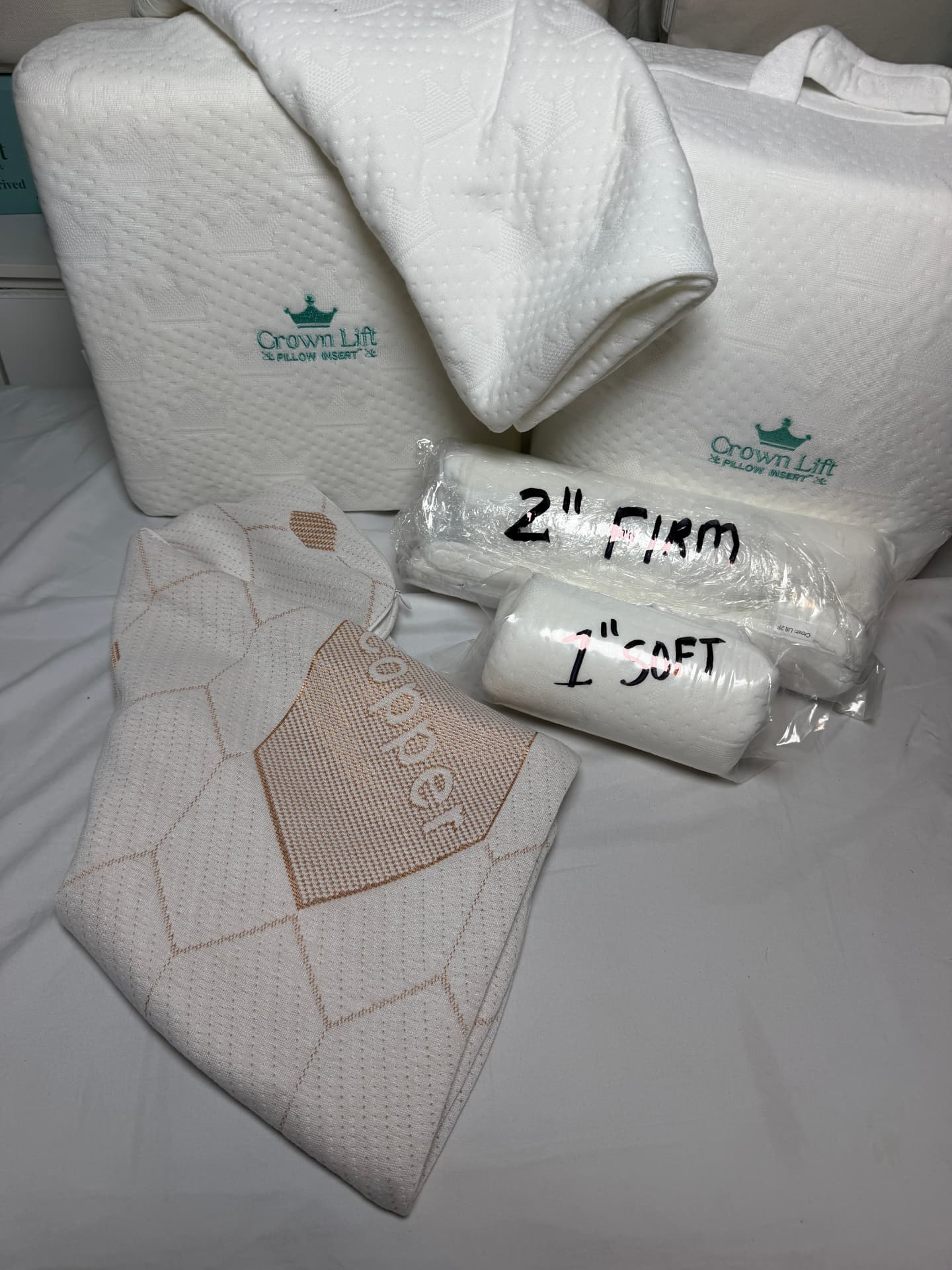 The Crown Lift kit: 1" soft and 2" firm support cores with the pocket pillowcase