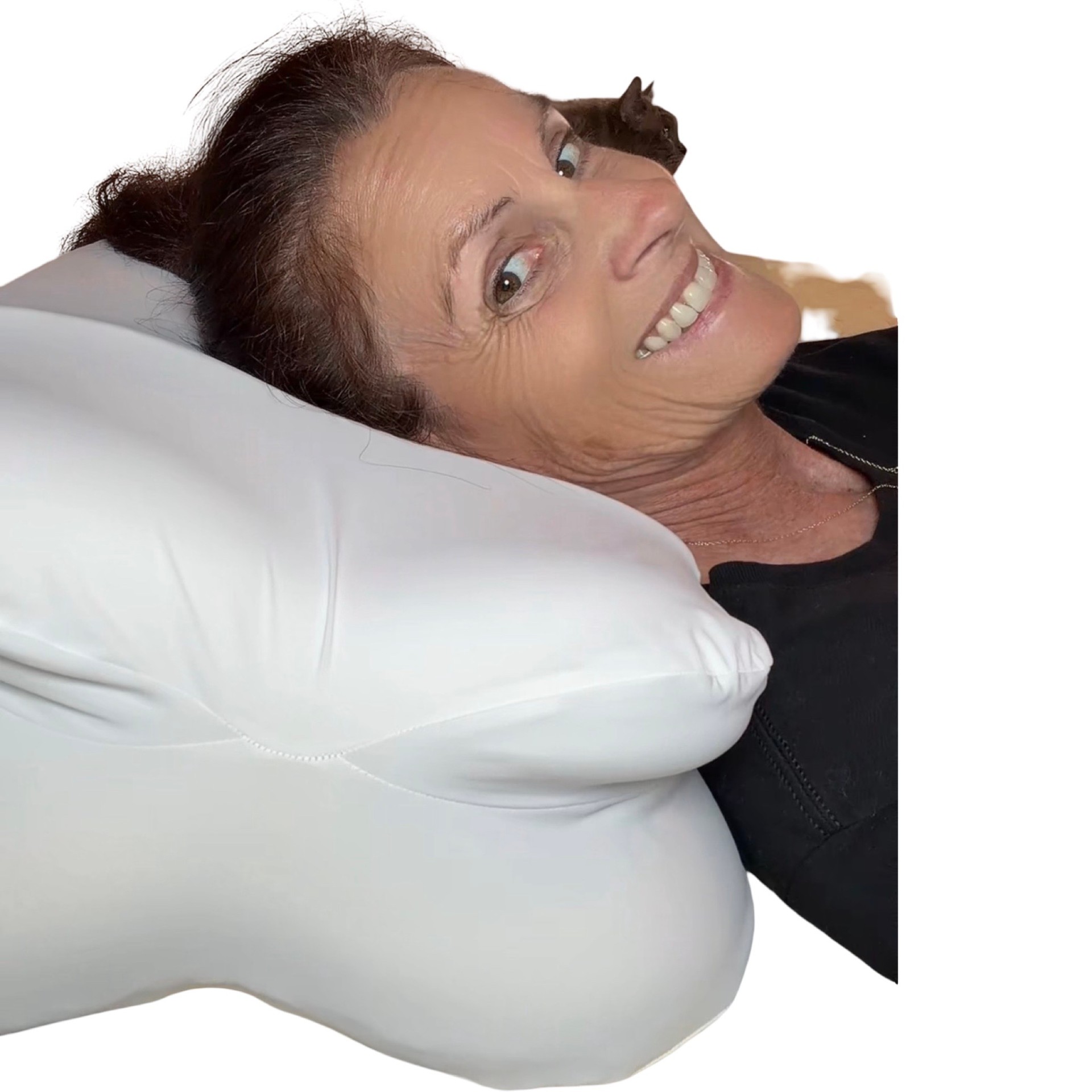 Happy sleeper on a pillow lifted by CrownLift Insert®